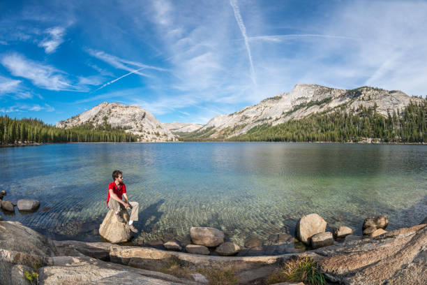 istock Man sitting on boulder Tenaya Lake Yosemite 1141579693