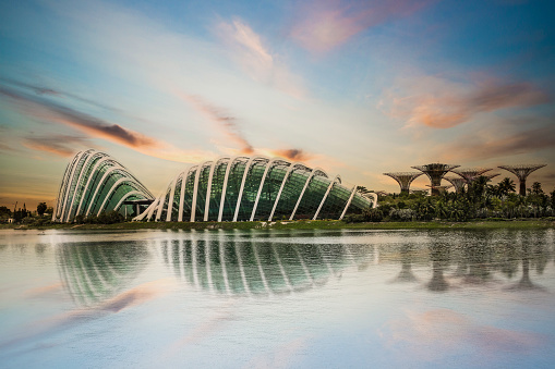 Singapore City, Singapore - April 03, 2019: Singapore Gardens by the bay at sunset. Gardens by the Bay is a nature park spanning 101 hectares (250 acres) of reclaimed land in the Central Region of Singapore, adjacent to the Marina Reservoir.