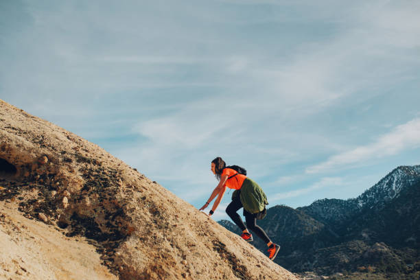 istock Climbing the Devil's Punchbowl rock formations in California 1141580275