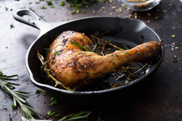 istock Chiken leg in a skillet 1141580430