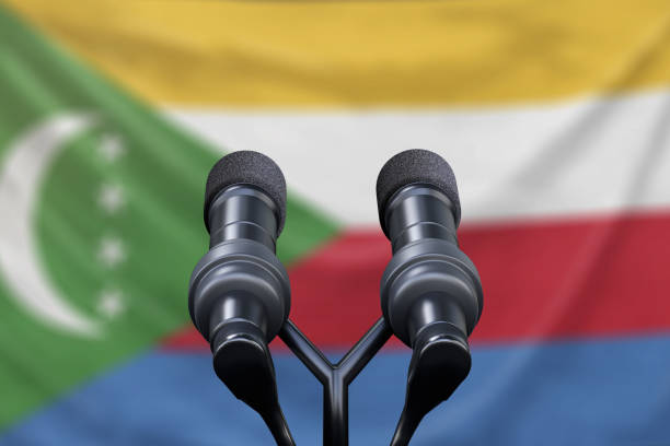 istock Comoros Flag with podium microphones 1141583762