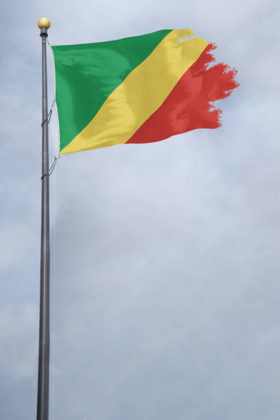 istock Worn and tattered Congo flag blowing in the wind on a cloudy day 1141583808