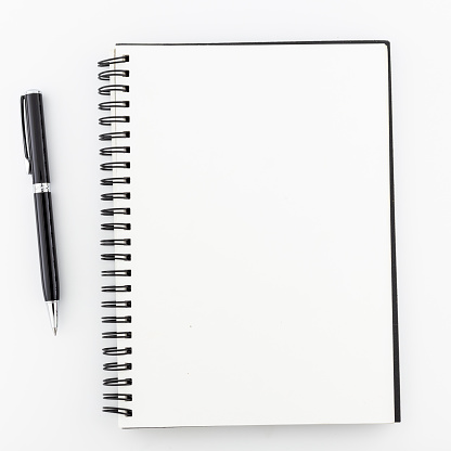 Top view, empty notebook on a white background.