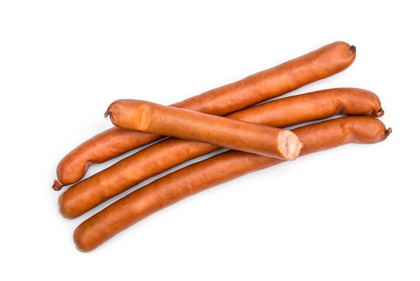 istock Heap of thin smoked sausage on white. Top view. 1141585986