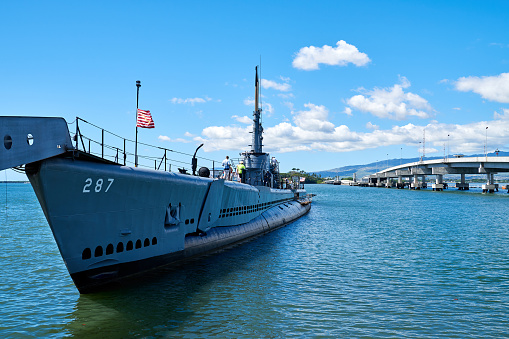 Honolulu, Hawaii, USA - February 20, 2018: Decommissioning submarine (USS Bowfin Submarine - World War II) parked at Pearl harbor at sunny day, Honolulu, Hawaii, USA.