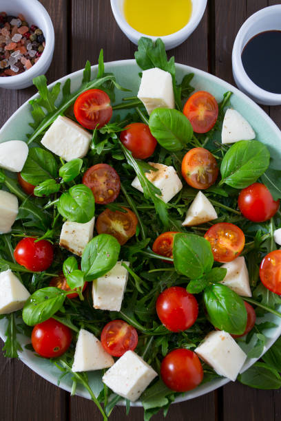 istock Vegetarian salad with cherry tomato, mozzarella and rucola 1141590874