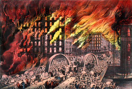 Vintage image depicting a scene from the Great Chicago Fire of 1871 where people were fleeing the burning city via the Randolph Street Bridge.