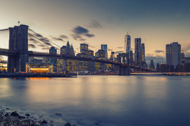 istock Brooklyn bridge East river and Manhattan at dusk 1141594118