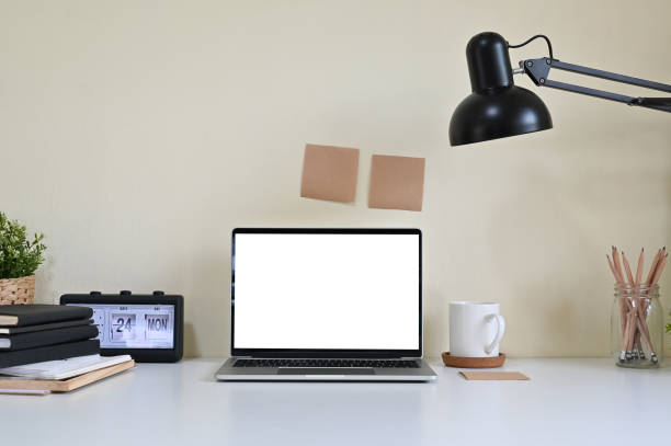 istock Mockup laptop computer and office supplies on workspace. 1141594710