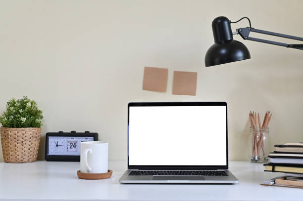 istock Mockup laptop computer and office supplies on workspace. 1141595386