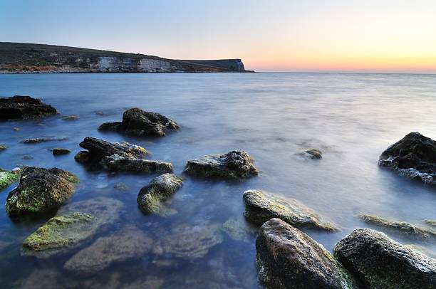 Sunset over sea  ebb and flow stock pictures, royalty-free photos & images