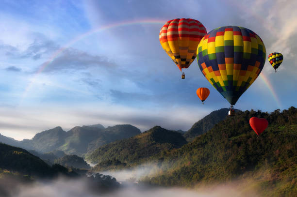 hot air balloons with landscape mountain. - hot air balloon landscape sunrise mountain imagens e fotografias de stock