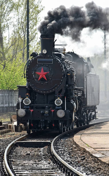 istock Old locomotive on the railway track 1141602911