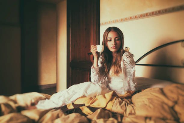 istock Young woman drinking coffee in the morning 1141604349