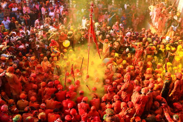 Lathmar Holi Festival in Nandgaon India 2019 The Gopas of Barsana play Holi with the Gopis of Nandgaon during the Lathmar Holi Festival in Nandgaon. The occasion is marked by singing of devotional and folk songs known as the "Samaaj". radha krishna stock pictures, royalty-free photos & images