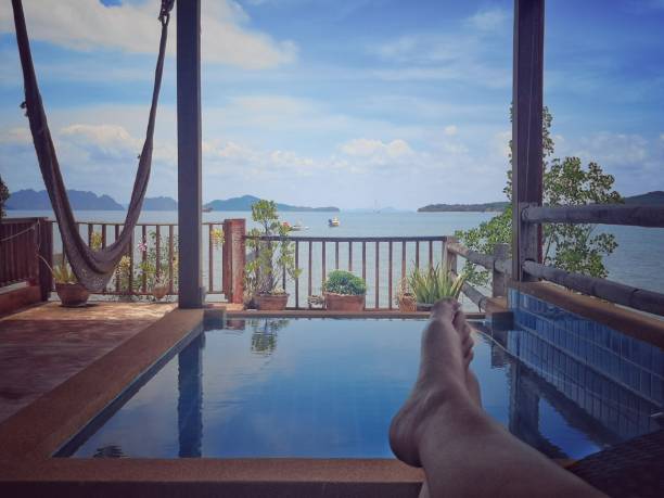 istock Relaxing by the pool personal perspective 1141604718