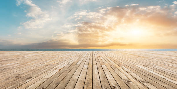 istock Wooden floor platform and blue sea with sky background 1141606422