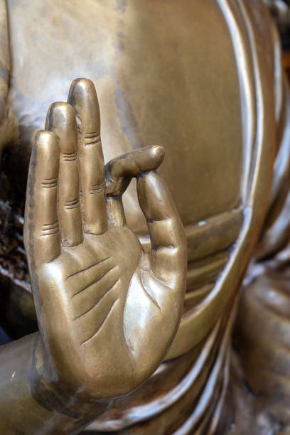 istock Beautiful bronze Buddha statue hand, close up 1141607153
