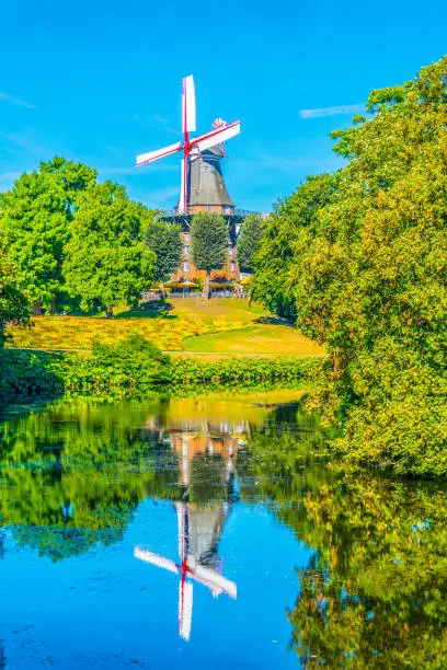 Photo of Wallanlagen with Am Wall Windmill and colorful flowers foreground in Bremen, Germany