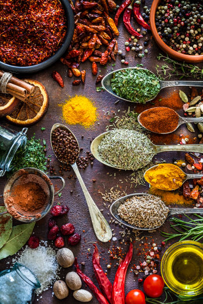 istock Spices and herbs shot from above on rustic brown table 1141613870