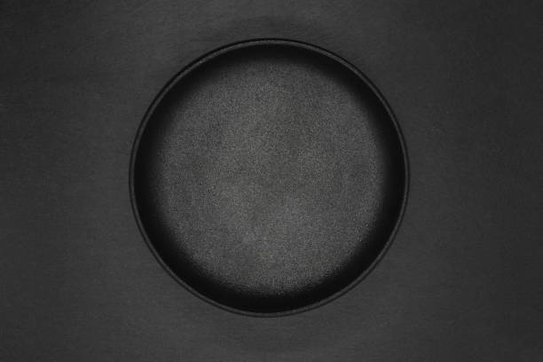 istock Top view of empty cast iron bowl on grey stone background 1141616785