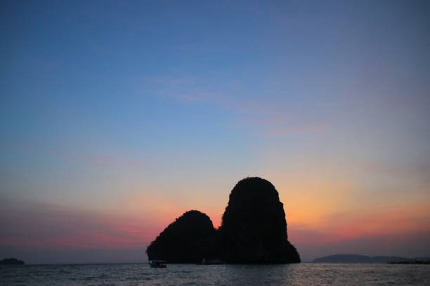 istock Sunset behind Rock Island on Phra Nang Beach 1141616972