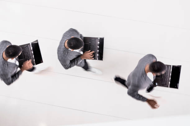 istock Businessman walking across the lobby 1141620163