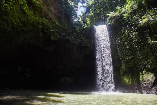 istock Tibumana Falls. Blowing waterfall in Bali. 1141620778