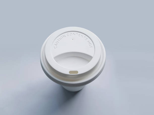 Top view of a white plastic coffee cup, isolated on a plain gray background