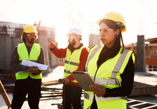 istock Young Latino woman architect with digital tablet on construction site 1141621641