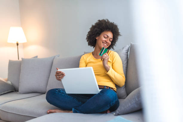 istock Mixed-race woman shopping on internet. 1141622415