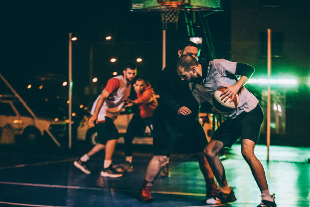 istock Friends playing streetball outdoors at night 1141624663