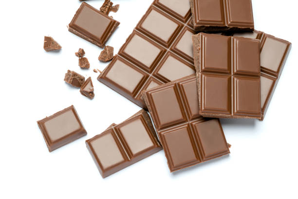 istock Milk organic chocolate pieces isolated on white background 1141625050