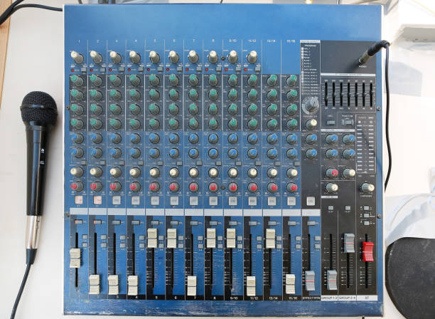 istock Sound levels on a professional audio mixer with microphone, Music control panel. 1141629240