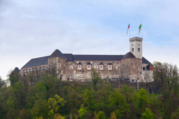 Ljubljana Castle Ljubljana, Slovenia - April 09 2019: Ljubljana Castle is a castle complex standing on Castle Hill above downtown Ljubljana. It is a key landmark of the town. Originally a medieval fortress, it was probably constructed in the 11th century and rebuilt in the 12th century. ljubljana castle stock pictures, royalty-free photos & images