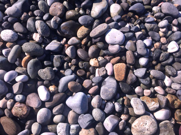 istock Abstract nautical background with pebbles, top view. 1141636782