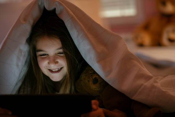 istock Watching her favorite cartoons before bed 1141638905