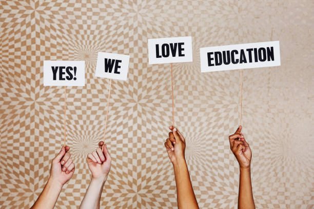 istock Raised hands hold signs 
