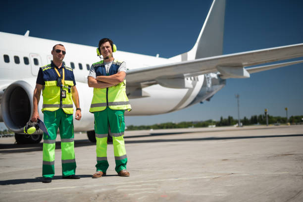 istock Cheerful workers at airport 1141641172
