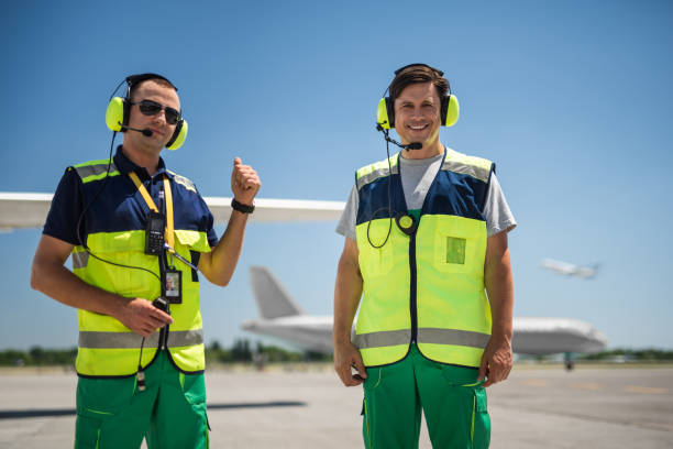 istock Cheerful workers at airport 1141641173