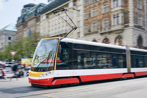 Daily life in the city. Modern tram of public transportation in blurred motion. Traffic at Wenceslas Square, Prague, Czech Republic.
