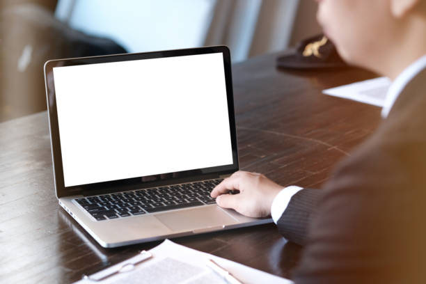 istock Man working by using a laptop computer on wooden table. Hands typing on a keyboard. 1141642584