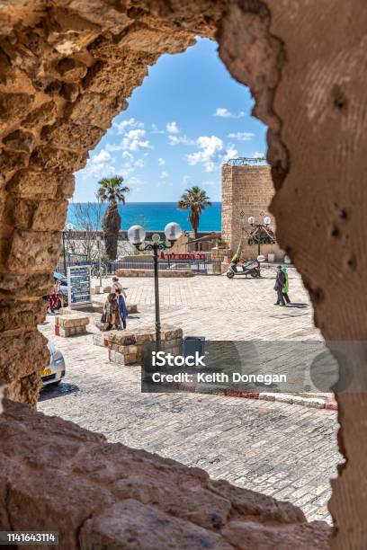 Looking Into Old Jaffa City Through Stone Window Stock Photo - Download Image Now - Ancient, Architecture, Blue