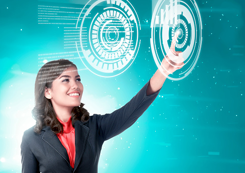 Pretty asian business woman touch a circle in virtual screen which display the interface of graph and binary code. Digital technology concept