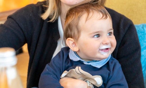 istock Baby boy with milk mustache making funny faces 1141644863
