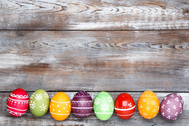 istock Colorful easter eggs on brown wooden table 1141646872