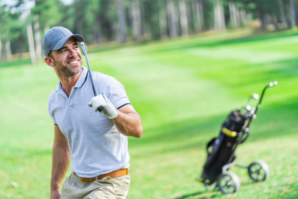 istock Male golfer standing on golf course 1141649530