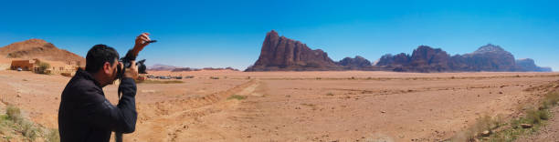 istock Photographer at Wadi Rum Desert in Jordan 1141649655