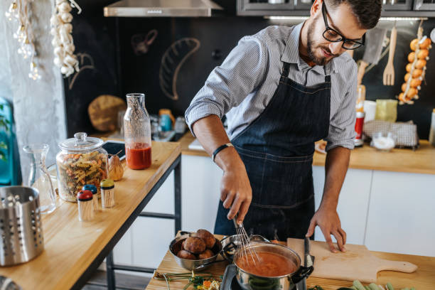 istock Man mixing food 1141650339