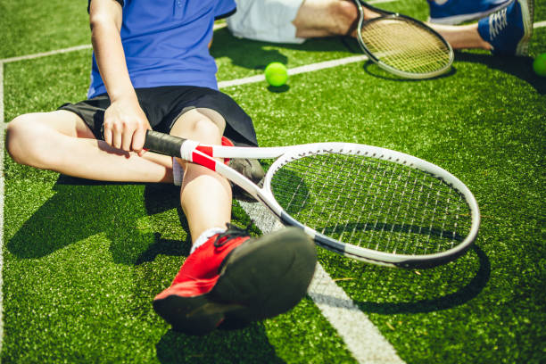 istock Boy resting after tennis game 1141650691